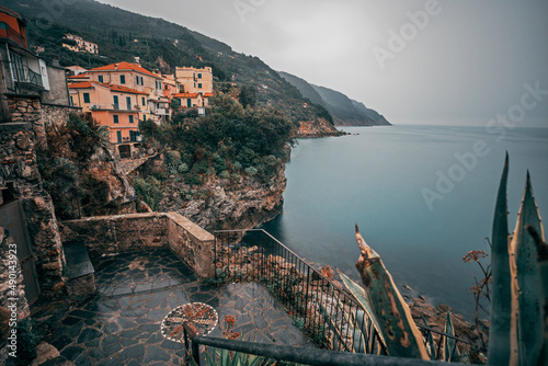 seascape with the town of tellaro on a rainy day