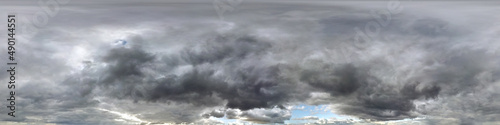 blue sky with dark beautiful clouds before storm. Seamless hdri panorama 360 degrees angle view  with zenith for use in 3d graphics or game development as sky dome or edit drone shot