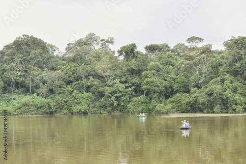 Scenic view of Dimbolil dam covered with green plants and reflecting the greenery in Kericho, Kenya photo