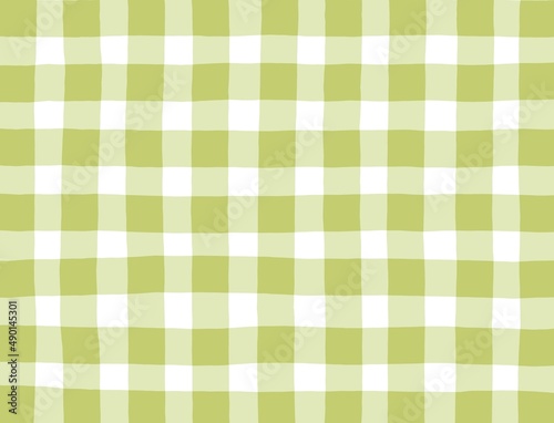 Green olive checkered background. Space for graphic design. Checkered texture. Classic checkered geometric pattern. Traditional ornament made of colored square elements. Abstract checkered background.