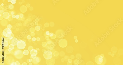 Yellow gold background with bokeh effect, blur and gradient. Colorful blurred texture. Modern design for abstract background. bokeh texture. Space for graphic design and creative concept ideas.