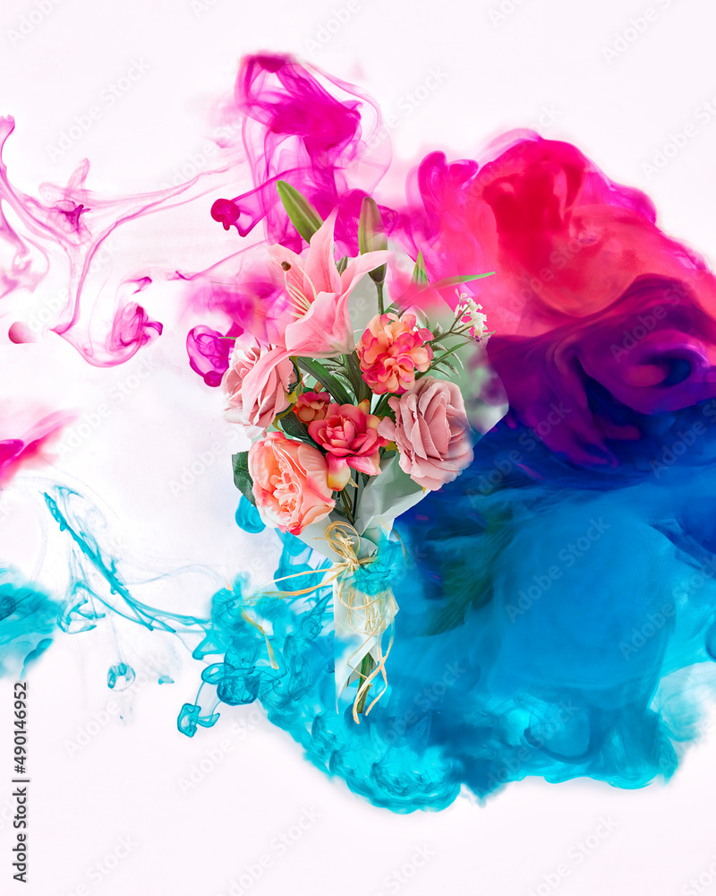 Creative color overflow concept of painting fresh flower bouquet. An explosion of neon colors pink and blue on white background.
