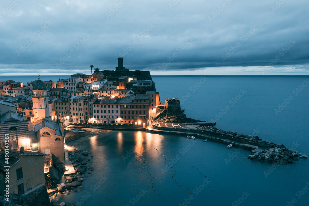 view of the town of vernazza at blue hour