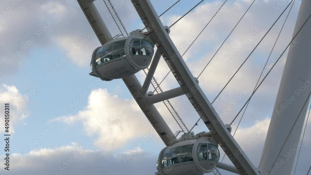 People Riding The Famous Ain Dubai Ferris Wheel In United Arab Emirates. Aerial Closeup People Riding The Famous Ain Dubai Ferris Wheel In United Arab Emirates. Aerial Closeup