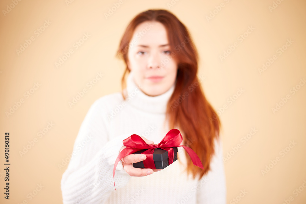 Close up photo of present box in female hands. Woman holding gift box. Valentine's day. Birthday or Holidays concept. Copy space Close up photo of present box in female hands. Woman holding gift box. Valentine's day. Birthday or Holidays concept. Copy space