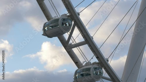 People Riding The Famous Ain Dubai Ferris Wheel In United Arab Emirates. Aerial Closeup photo