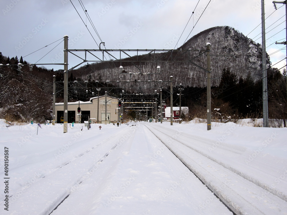 Miyagi, Japan - February 23, 2022: Fully snow-covered railroad in Miyagai, Japan

