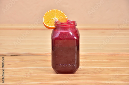 Closeup shot of the Sangria drink on the wooden background photo