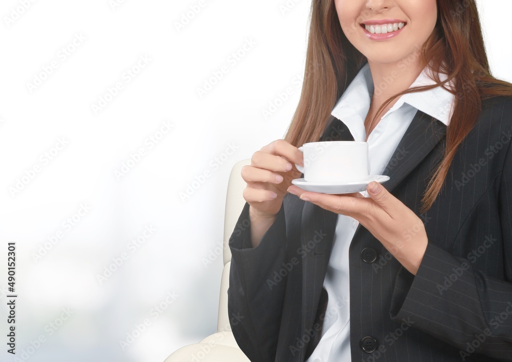 Woman hands holding cup of tea or coffee. Relax at home on sofa. Woman hands holding cup of tea or coffee. Relax at home on sofa.