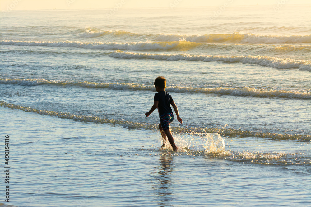Cute kids having fun on sandy beach in summer Cute kids having fun on sandy beach in summer