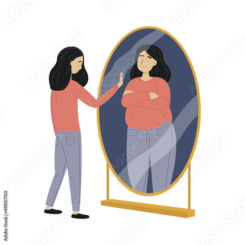 woman with eating disorder standin by the mirror