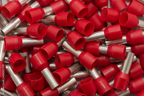 Electric wire ferrules or end sleeves for electrical cables as background. Crimp terminals for electrical wires, tools for electricians 