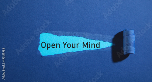 Open Your Mind text on torn paper.