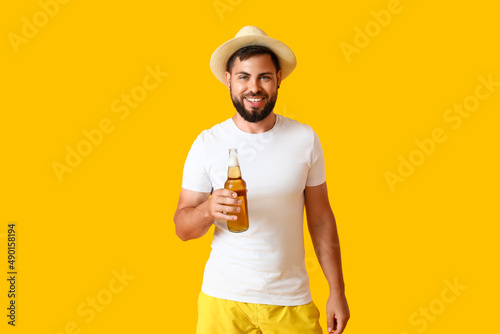 Young man in hat with bottl...