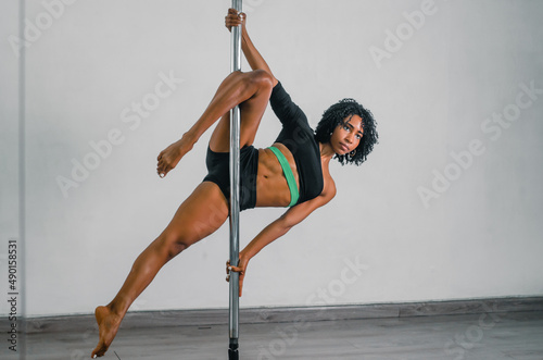 pole dance black girl in bikini posing