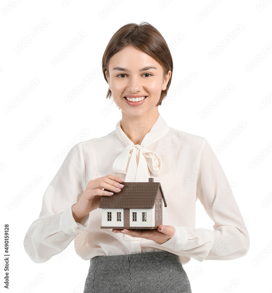 Female real estate agent with figure of house on white background Female real estate agent with figure of house on white background