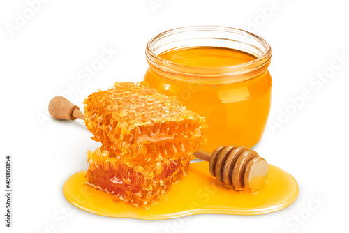 Honeycombs and honey puddle isolated on white background with clipping path and full depth of field