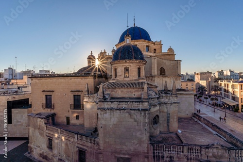 Basilica Santamaria of Elche and Castle of Altamira in the background. Located in Alicante, Spain photo
