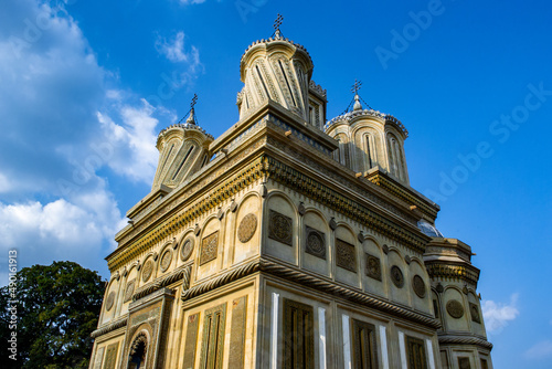 Scenic view of the Cathedral of Curtea de Arges in Romania on cloudy sky background photo