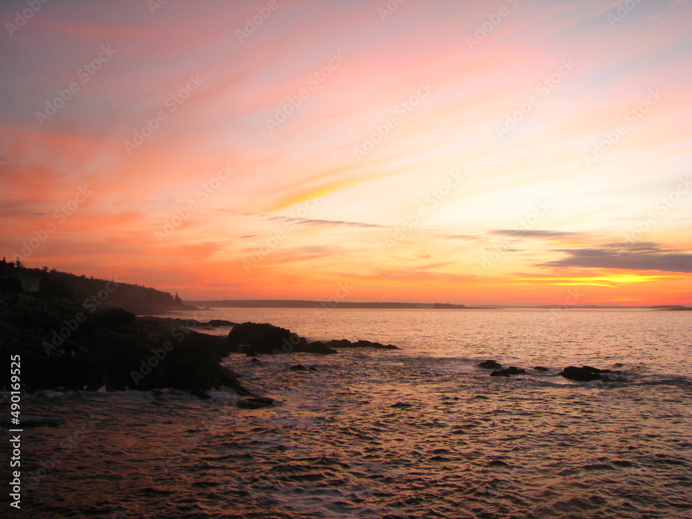 fiery sky over peaceful ocean