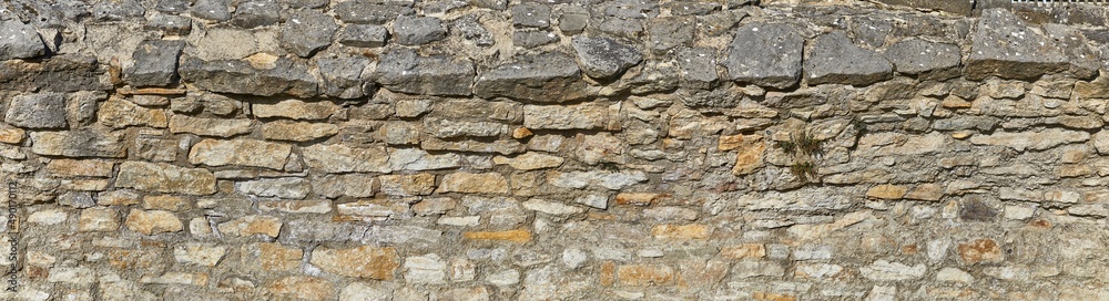 Rustic castle wall. Close-up. In poster format.