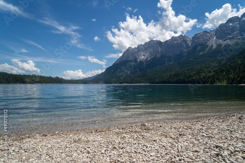 Obraz na płótnie Scenic view of a lake near an alpine mountain