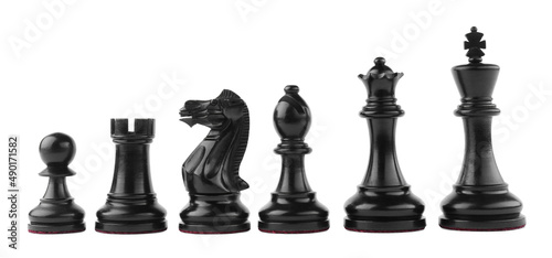 Row of black chess pieces on white background photo