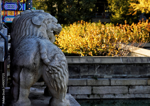 White statue of a lion with mouth open in the Summer Palace, Beijing, China photo