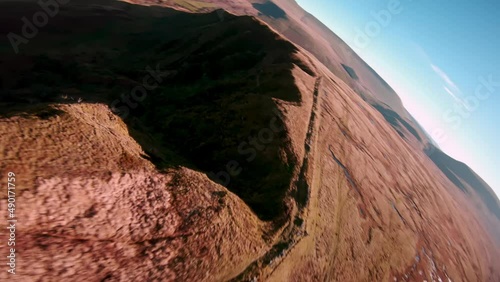 Flying Drone over the ridge of brecon beacon national park, fast paced unique drone footage. photo