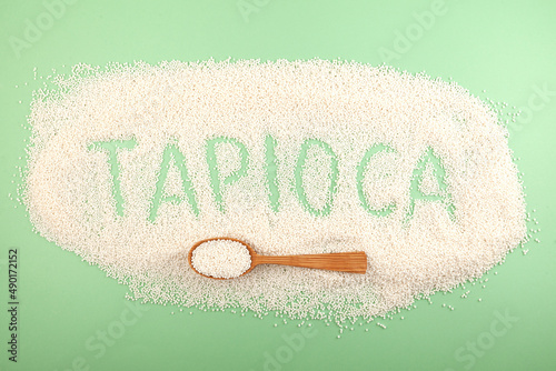 Inscription Tapioca of tapioca pearls. White small sago balls in wooden spoon. Balls use for bubble tea, boba drinks and refreshments cocktails
