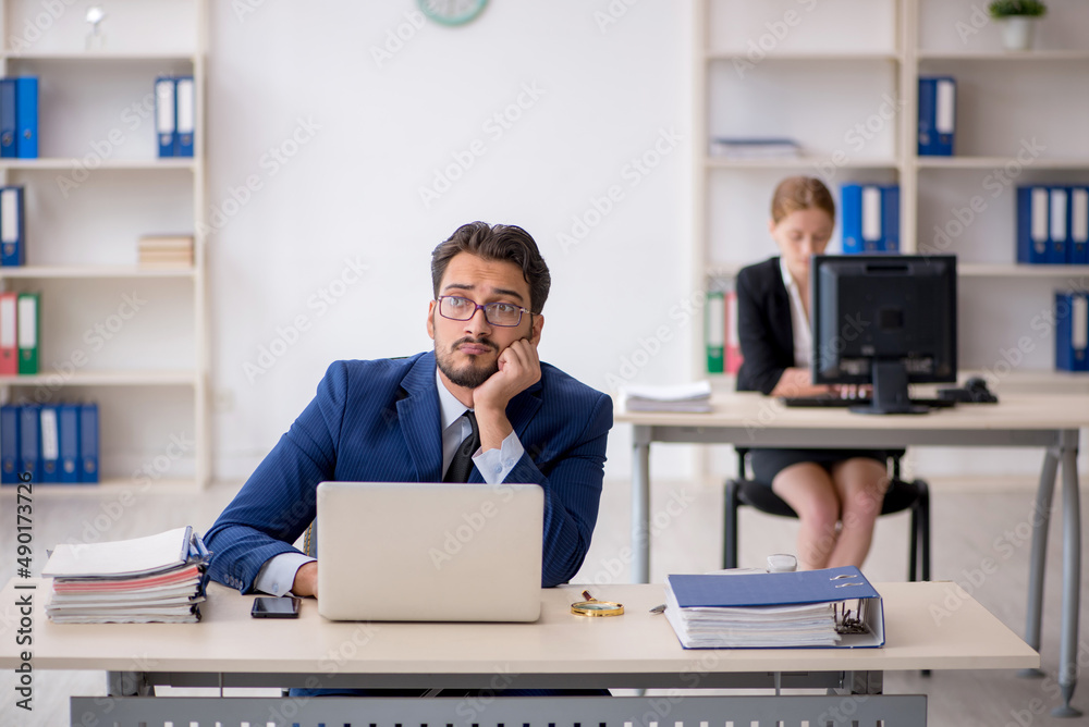 Two colleagues working in the office