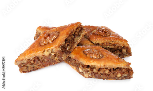 Delicious honey baklava with walnuts on white background