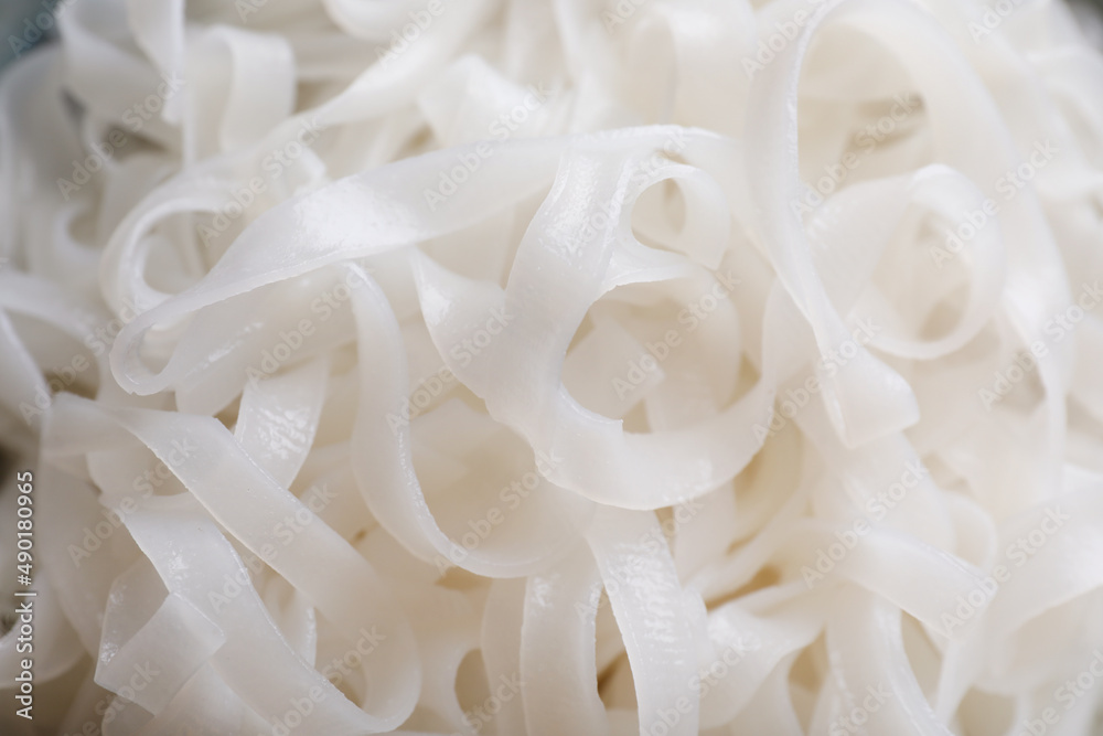Tasty cooked rice noodles as background, closeup Tasty cooked rice noodles as background, closeup