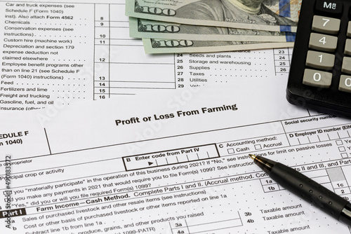 Farm tax form and cash money. Farming income, finances and management concept.