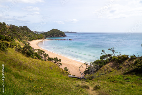 View over a deserted private beach near Sandy Bay on New Zealand's Tutukaka Coast. photo