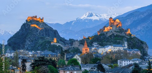 Historical Sion town with its two castles at late evening Switzerland photo