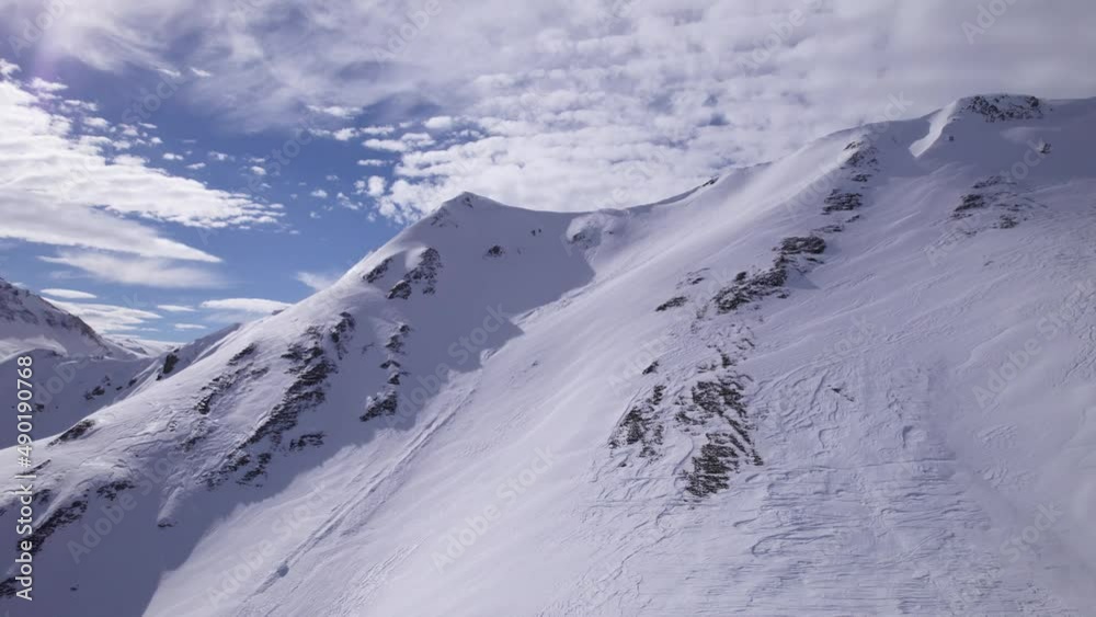 Flying Towards a Mountain Ridge in the Snowy Alps - Dolly In Shot - Shot in Tignes and Val d'Isere Flying Towards a Mountain Ridge in the Snowy Alps - Dolly In Shot - Shot in Tignes and Val d'Isere