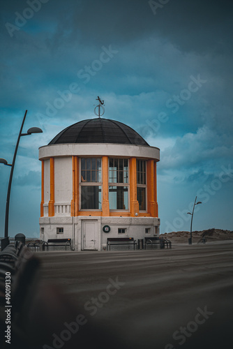 Vertical shot of Musikpavillon in Borkum, Germany against a cloudy sky photo