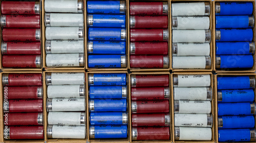 Red, white and blue shotgun shells. Background photo