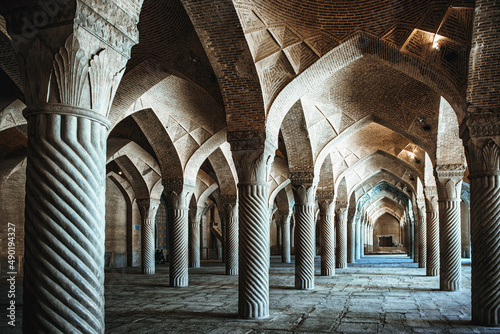 Interior with columns and pointed arches in Vakil Mosque in Shiraz, Iran