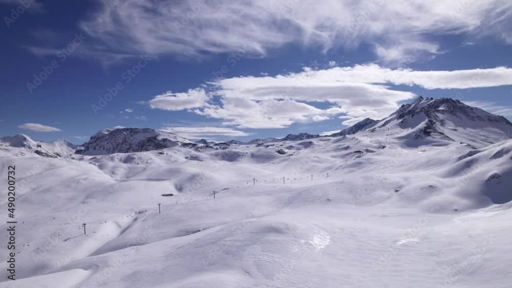 Ski Tourists in the Alps Aerial View of Snow-covered French Mountains - Dolly In Shot - Shot in Tignes and Val d'Isere Ski Tourists in the Alps Aerial View of Snow-covered French Mountains - Dolly In Shot - Shot in Tignes and Val d'Isere