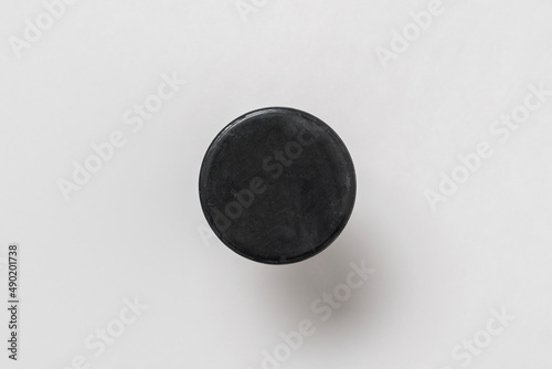 hockey sport black rubber puck isolated close up view