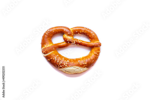 Freshly baked pretzel close-up, isolated on a white background photo