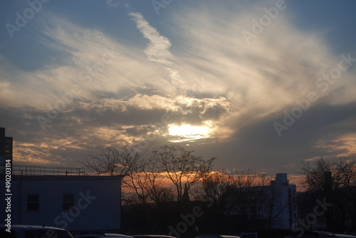 Beautiful scene of the sunrise sky on building and trees in West Point, NY State, USA photo