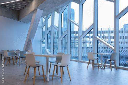 Clean, white seating area in Central Library with a city view in Calgary, Alberta, Canada