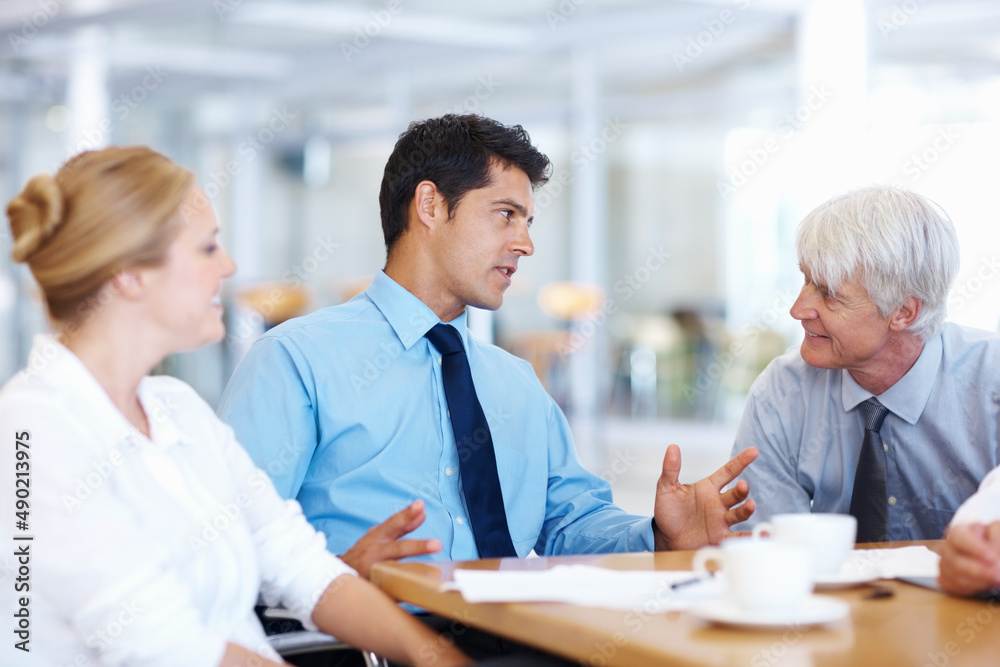 Business men discussing with female executive. Portrait of business men discussing with female executive at meeting. Business men discussing with female executive. Portrait of business men discussing with female executive at meeting.