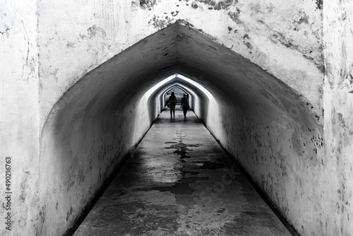 Silhouette of people at Taman Sari underground tunnel in Yogyakarta
