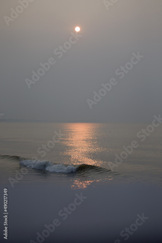 Sunrise scenery along the coast of Qinhuangdao, China photo