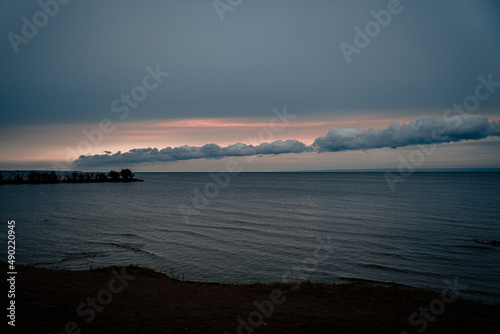 Beautiful seascape under a gray cloudy sky photo