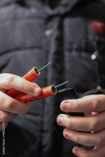 Kid Holding Dangerous Red Petards